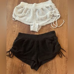 Two swimsuit short covers, black and white.